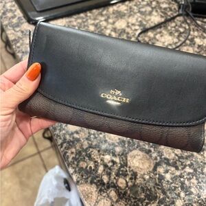 Coach Black and Brown Leather Clutch small tear on side
